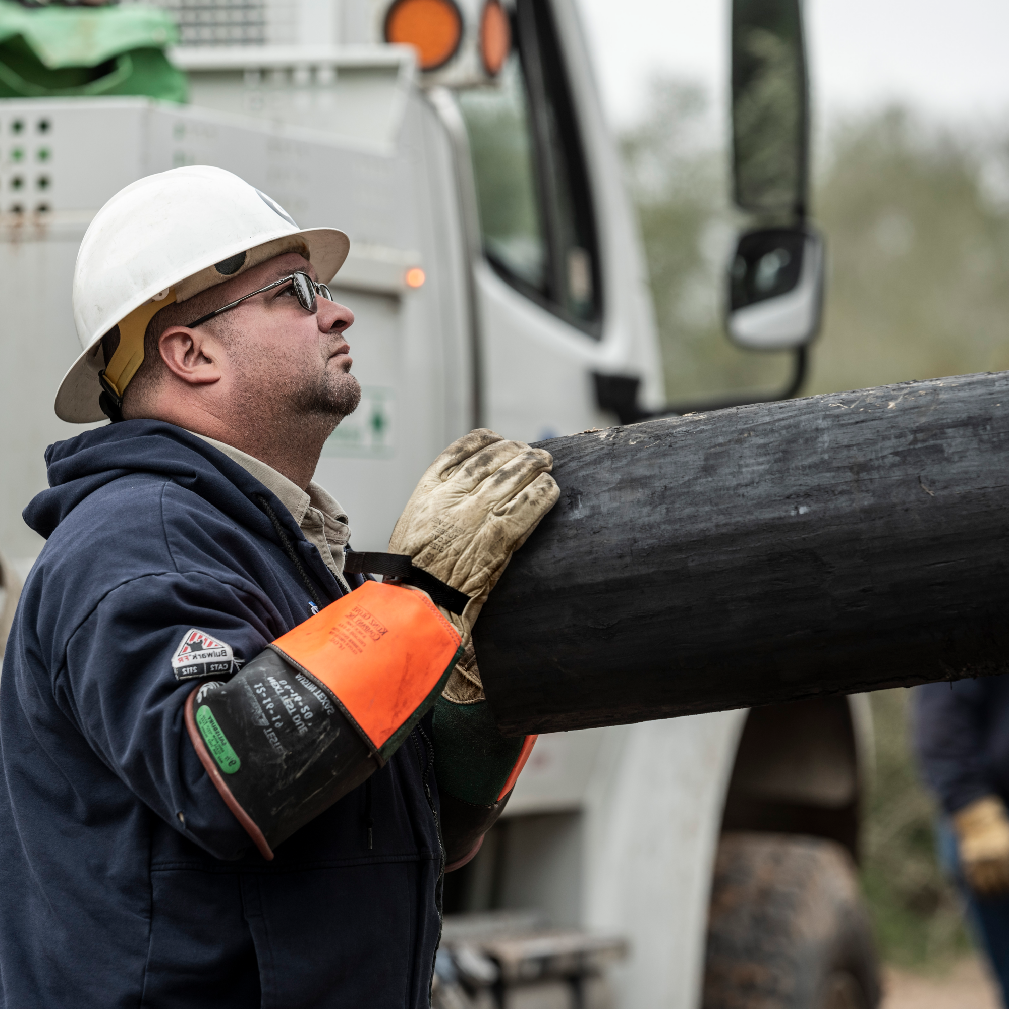 lineworker lifting pole